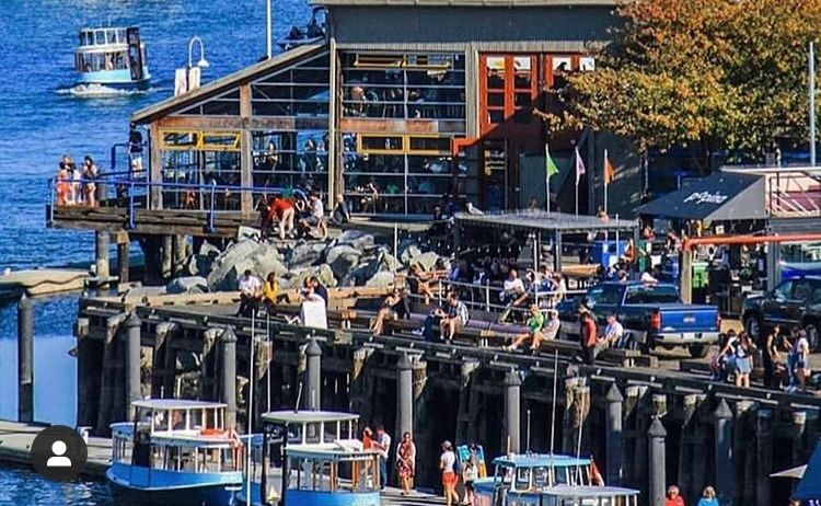 the Granville Island Publiic Market with a line of False Creek Ferries at the dock