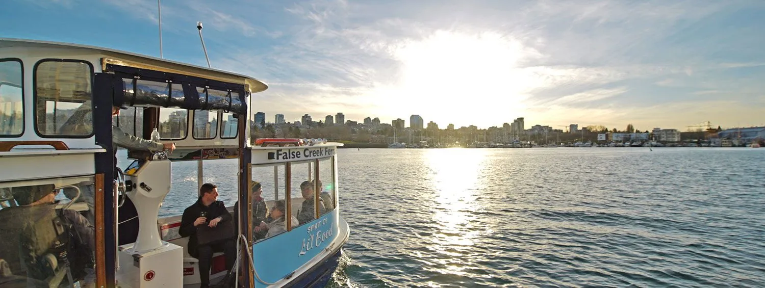 a ferry sailing away toward the sun